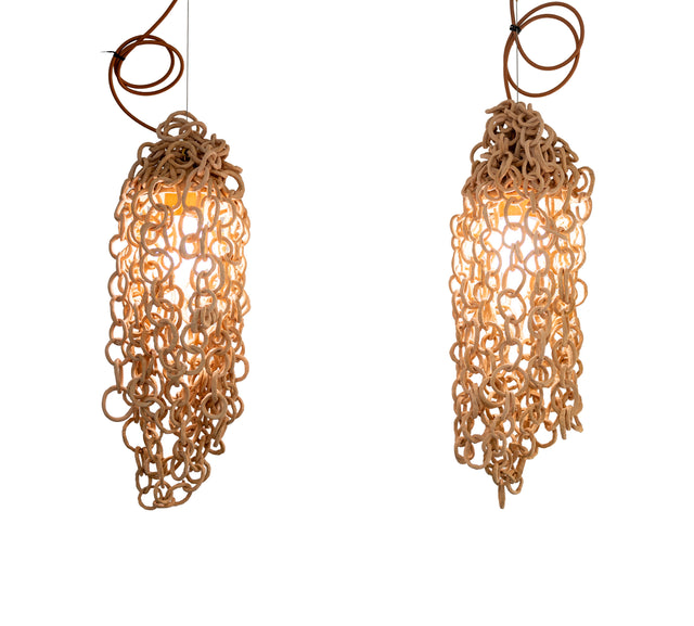 Pair of ceramic chain pendant lamps in unglazed stoneware links, lit, by Peter Souza Jr., J Schatz