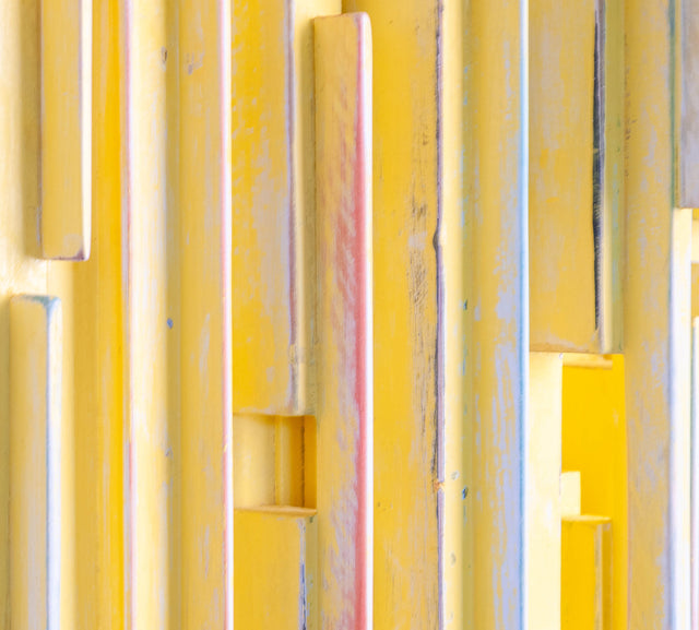 Wall sculpture, detail of painted figures gathering and dispersing, J Schatz