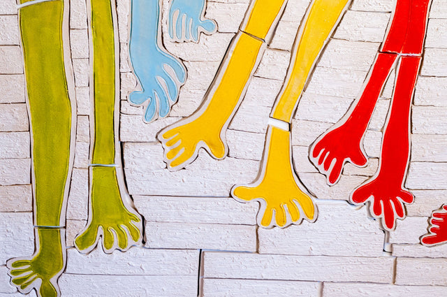 Ceramic wall pieces and tile works by J Schatz — reliefs and installation works.