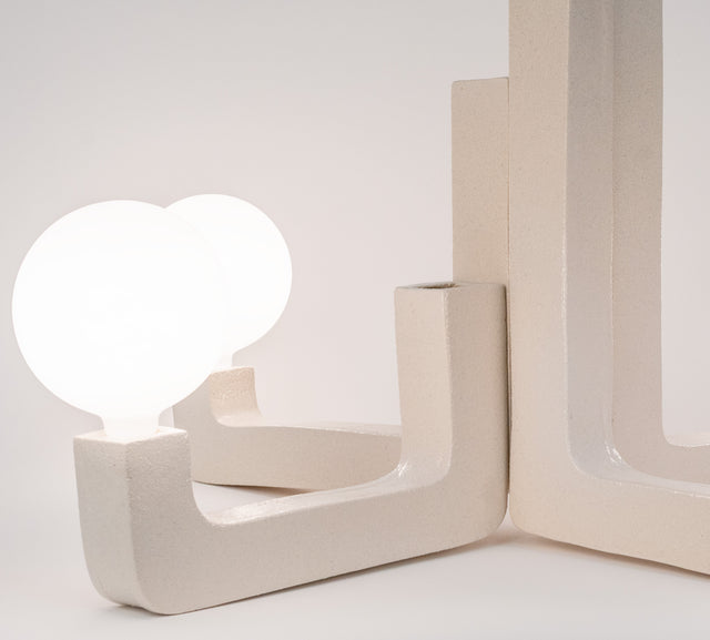 Ceramic chandelier with four frosted globes on a stepped column, J Schatz