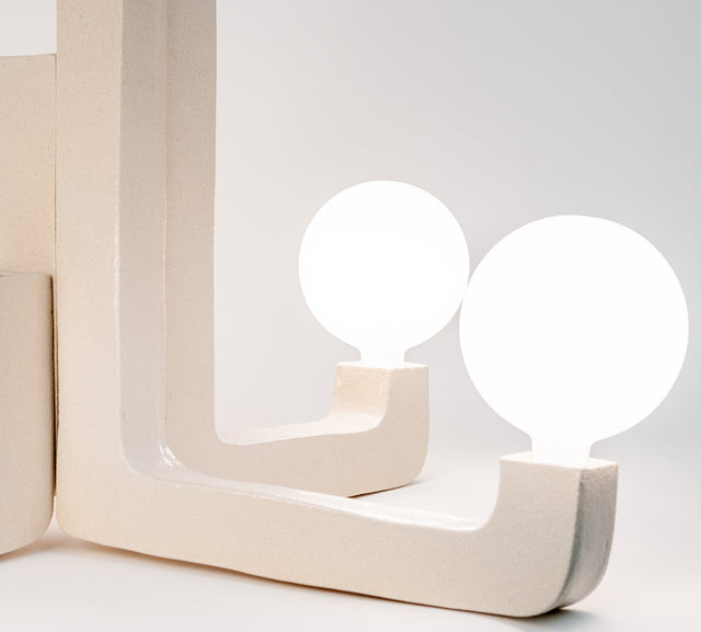 Ceramic chandelier, detail of frosted globe and textured stoneware arm, J Schatz