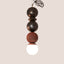 Dot Dot Dot Pendant Metallic Edition in Bronze, Bronze, and Rust Red with omega disc