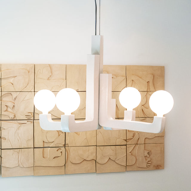 Four-arm white stoneware ceramic chandelier with frosted globes at Take Me Home, J Schatz
