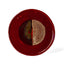 Geometria Platter 12/43 over 59 — one-of-a-kind hand-built stoneware platter in deep oxblood red with a split half-moon composition in dusty rose and olive-bronze, hand-glazed in Detroit by J Schatz.