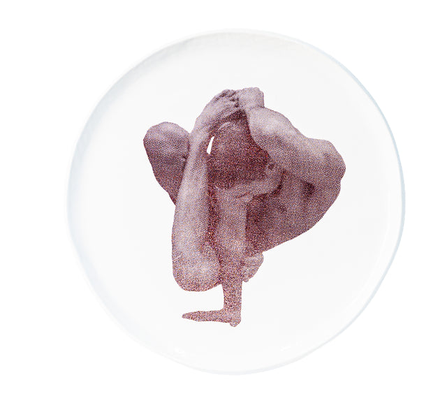 Brown oxide transfer of a one-arm balance with leg drawn back on stoneware Gestures plate, J Schatz.
