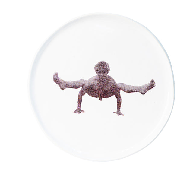 Brown oxide transfer of a wide squat with arms braced on stoneware Gestures plate, J Schatz.