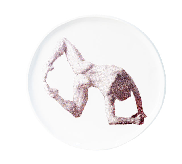 Brown oxide transfer of a standing backbend folded to the feet on stoneware Gestures plate, J Schatz.