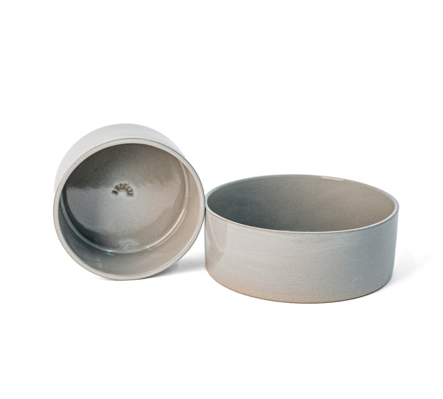 Slate grey ceramic Utilità bowls, one tipped to show the glazed interior, J Schatz.