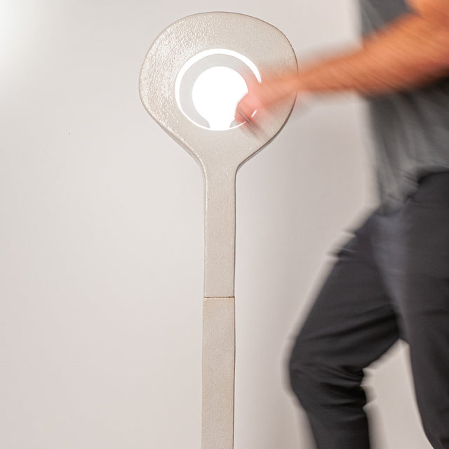 Aura Floor Lamp with designer walking in front