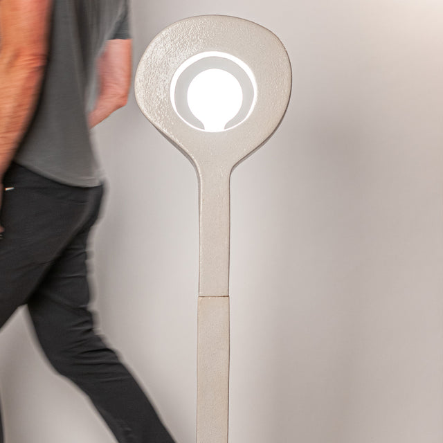 Aura Floor Lamp with designer walking past