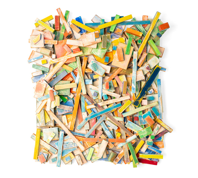 Wall work of layered painted wood offcuts in blue, orange, green, and yellow, J Schatz