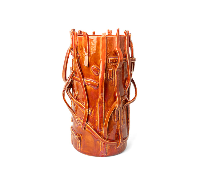 Rust-glazed stoneware vessel, strips rising past the rim in uneven prongs, by Peter Souza Jr., J Schatz