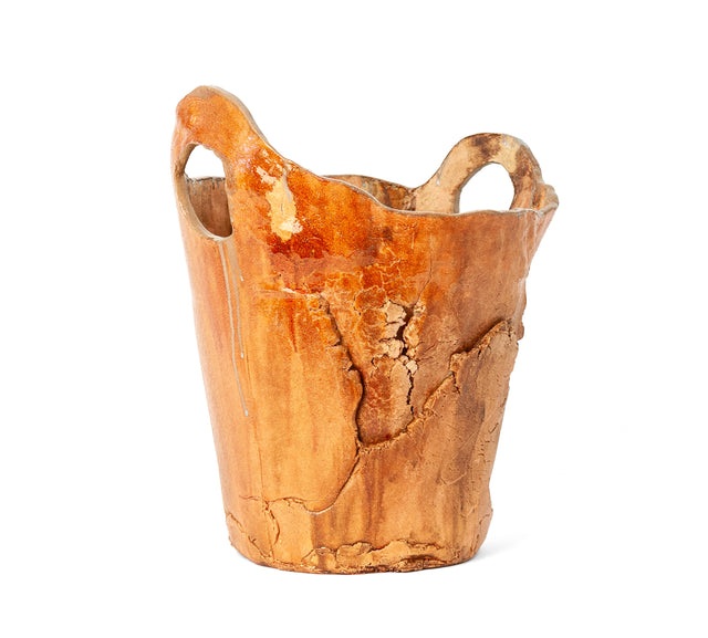 Rustic Container 1 by Jim Schatz — tall hand-built ceramic vessel with looped handles and a glossy orange-rust terracotta glaze, three-quarter view