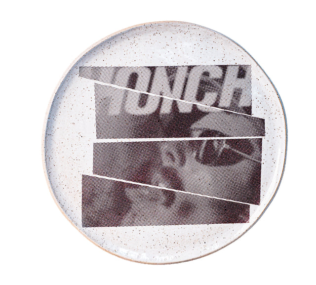 Honcho masthead and a cropped face in sunglasses cut into offset strips under glaze on speckled stoneware plate, J Schatz and Peter Souza Jr.