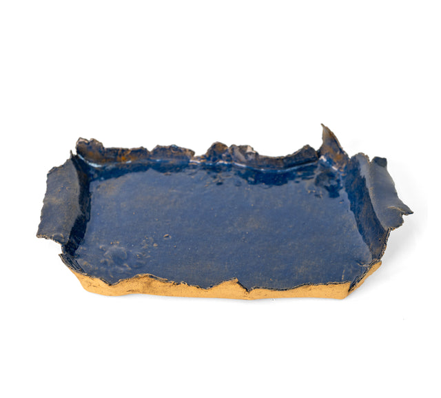 Cobalt-glazed stoneware tray seen from above, ragged rim over raw speckled clay, by Peter Souza Jr., J Schatz